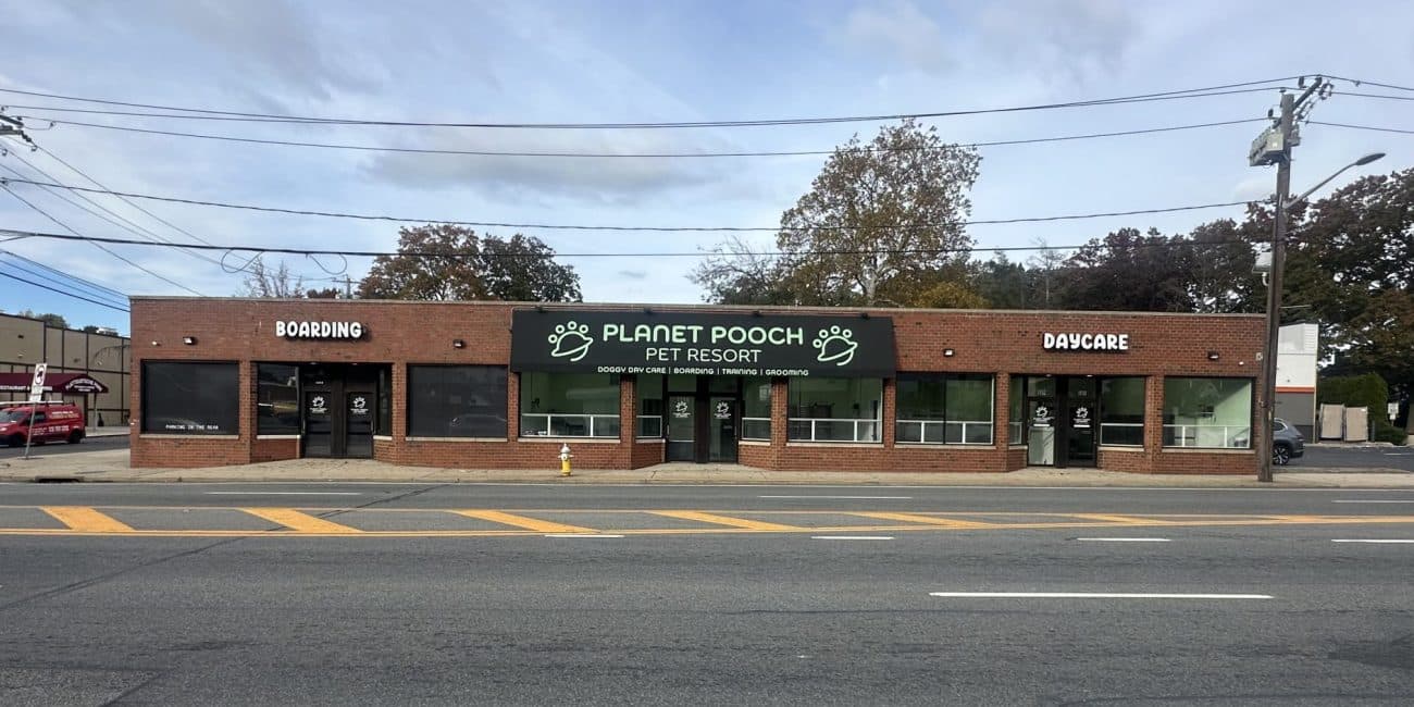 Planet Pooch Pet Resort exterior with daycare and boarding entrances